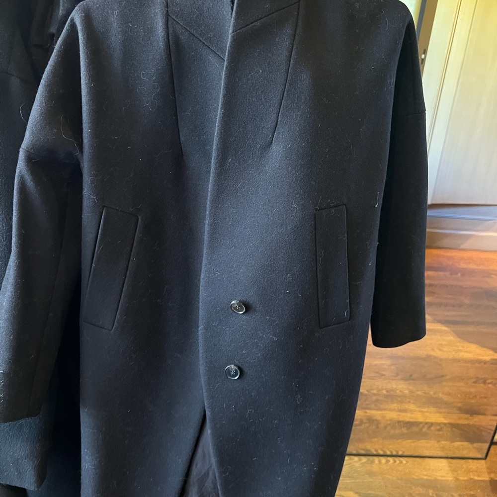 Black Trench Coat with Tailored Lines and Structured Shoulders